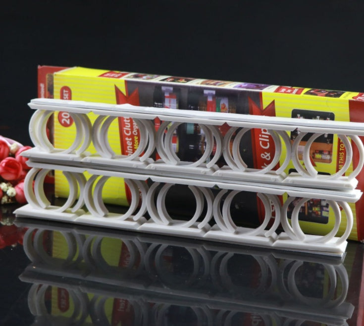 Adhesive spice rack standing in front of its retail packaging box