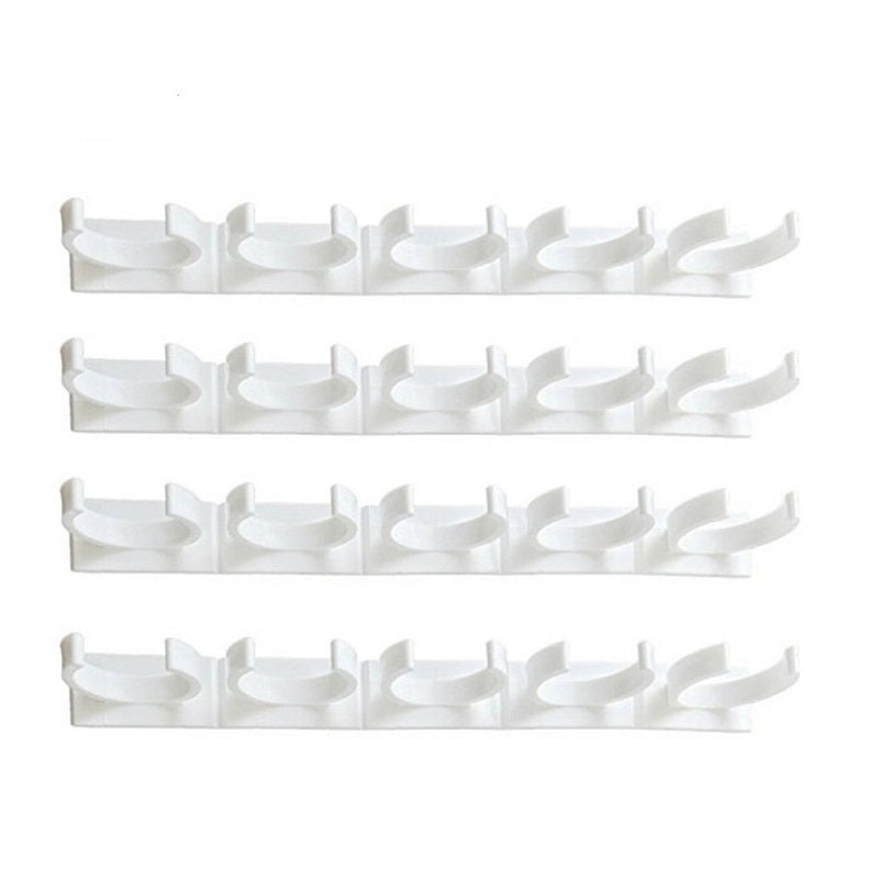 Adhesive spice bottle rack with four rows of curved clip holders on a white background