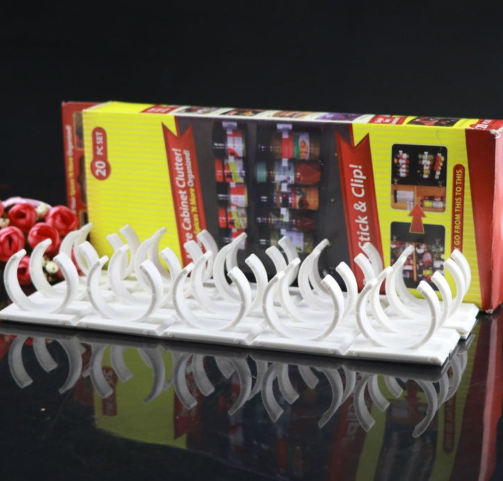 Close-up of the curved clip holders on the adhesive spice rack