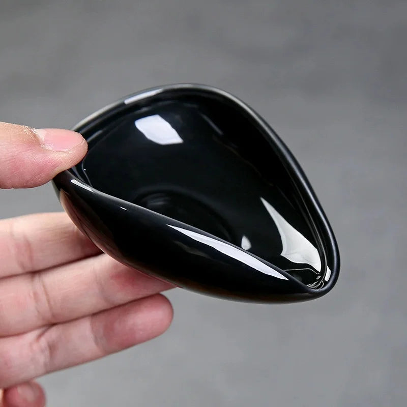 Coffee beans inside ceramic dosing cup for espresso preparation