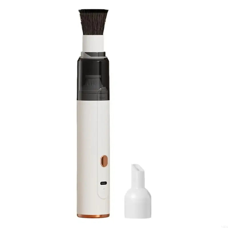 White coffee grinder cleaner with brush head and nozzle attachment on a white background