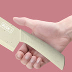 Close-up of a hand holding the cleaver knife handle to show its grip