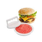 Burger press with a raw patty next to an assembled cheeseburger with lettuce and tomato