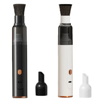 Cordless coffee grinder cleaner in black and white with brush head and nozzle attachment