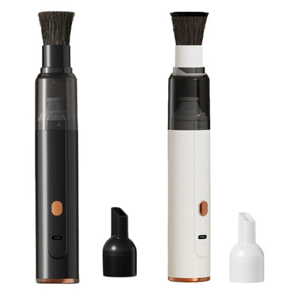 Cordless coffee grinder cleaner in black and white with brush head and nozzle attachment
