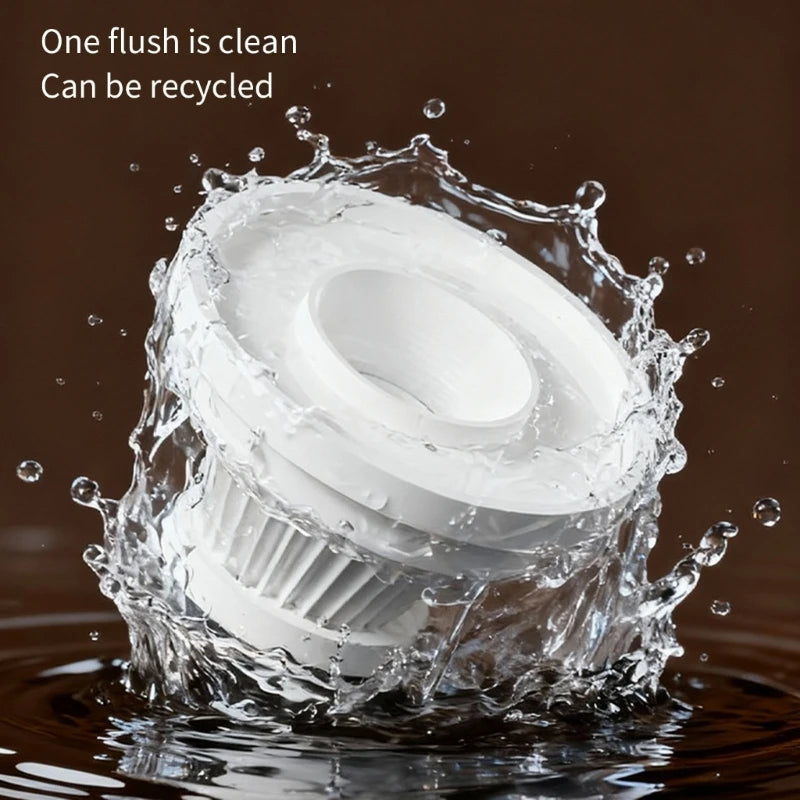White filter piece splashing in water, showing it can be rinsed clean and reused