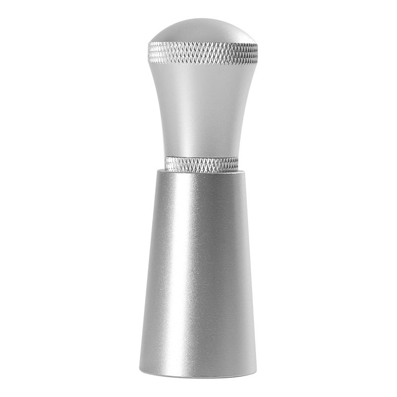 Frosted silver coffee distribution tool with knurled grip on a white background